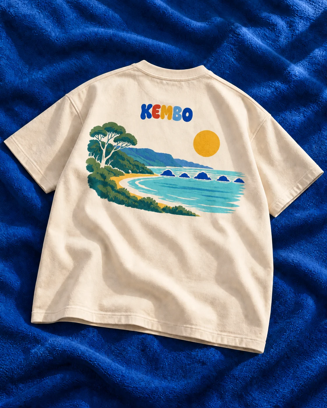 Back concept of the ecru oversized tee with a coastal escarpment, eucalypt foliage and five separate island shapes